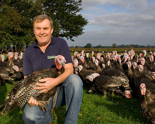 farmer with award winning bronze turkey