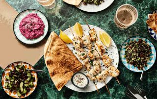 Monkfish Skewers on a plate with flatbread