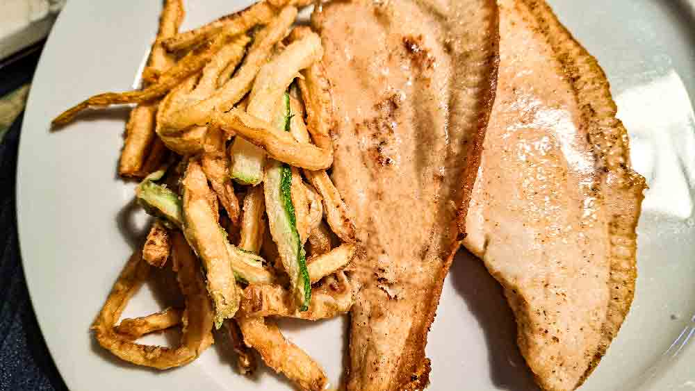 plaice with courgette fries on plate